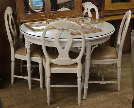 A white painted bamboo effect circular topped dining table and four chairs table W.110cm